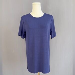 Soft periwinkle tee offers a crew neckline, relaxed fit, & buttery soft fabric.
